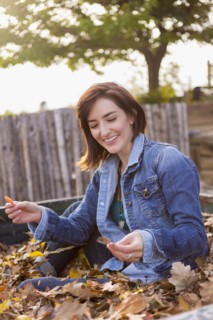 Hispanic woman playing in truck bed