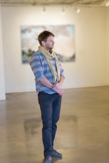 Caucasian man standing in art gallery