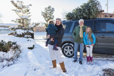 Caucasian family smiling in snow