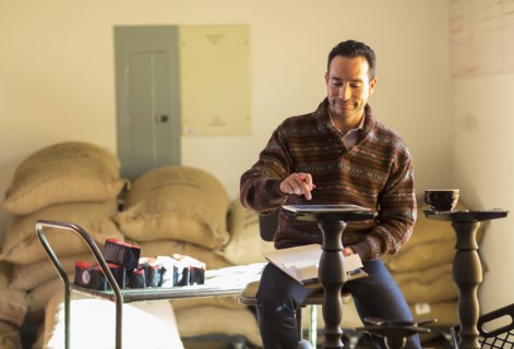 Hispanic entrepreneur using digital tablet