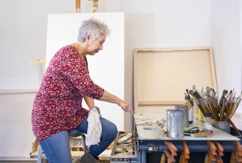 Artist painting in studio
