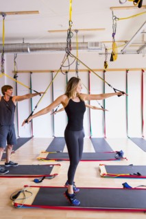 People using resistance bands in gymnasium