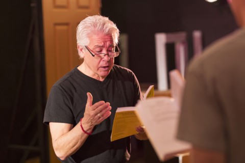 Teacher talking to students in theater class
