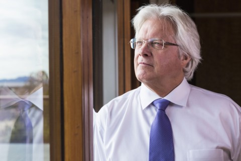 Pensive Caucasian businessman near window