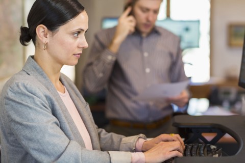 Caucasian businesswoman using computer