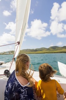 Caucasian brother and sister on sailboat