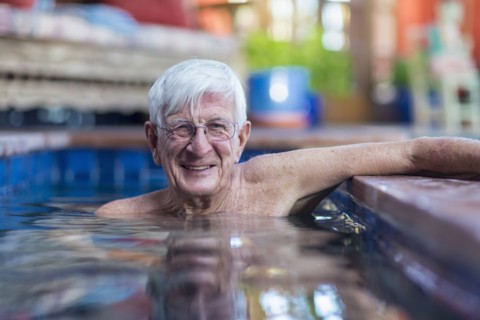Portrait of smiling Caucasian man in swimming pool