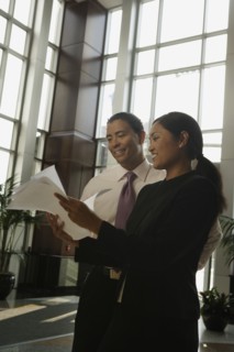 Multi-ethnic businesspeople looking at paperwork