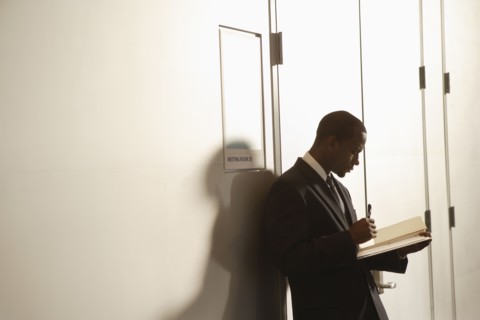 African American businessman looking at paperwork