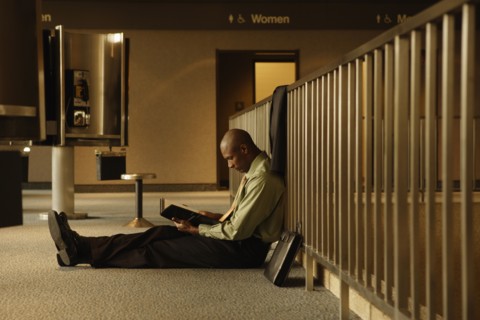 African businessman reading book