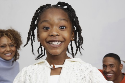 African girl in front of parents