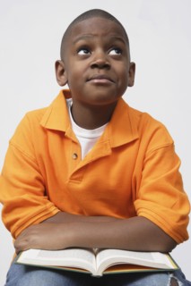African boy holding book