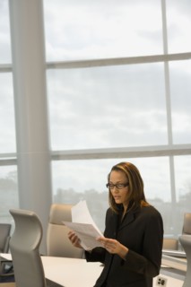 African businesswoman reviewing paperwork
