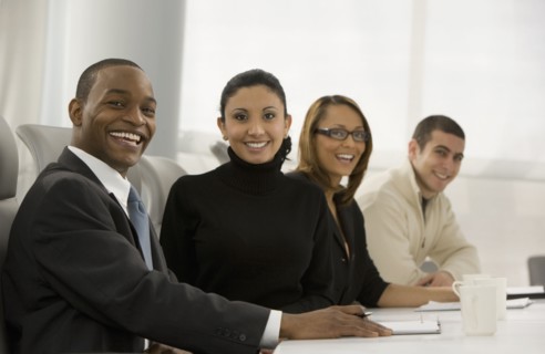 Multi-ethnic business people posing in meeting