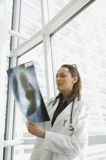African doctor reviewing x-ray