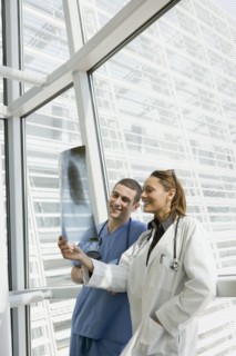 Multi-ethnic doctor and nurse reviewing x-ray