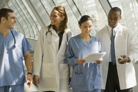 Multi-ethnic doctors and nurses in corridor
