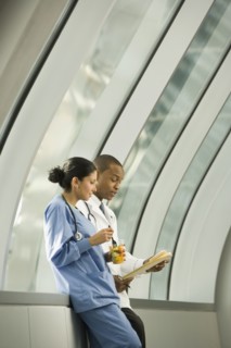 Doctor and nurse reviewing medical chart