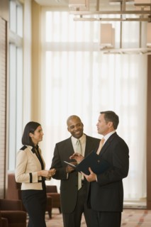 Multi-ethnic business people talking in corridor