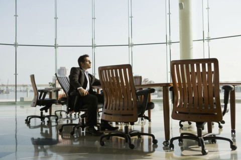Businessman waiting in conference room for meeting
