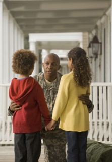 African soldier talking to son and daughter