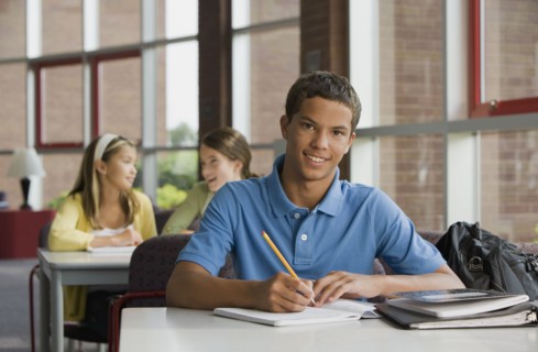 Mixed race teenager doing homework