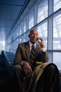 African businessman using cell phone