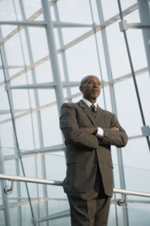 African businessman standing with arms crossed