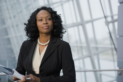 African businesswoman holding paperwork