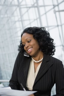 African businesswoman using cell phone