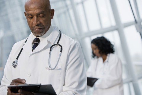 African doctor reviewing medical chart