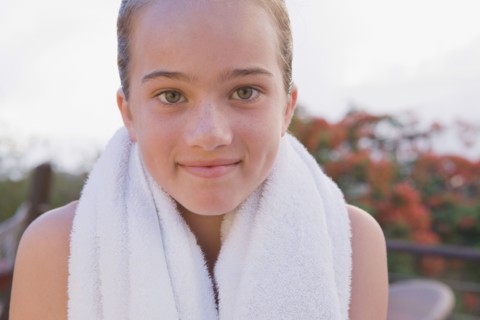 Close up of girl with towel around neck