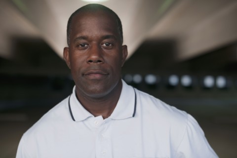 African man standing in parking garage