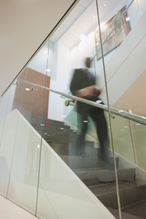 African American businessman descending staircase