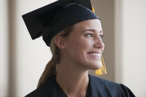 Caucasian graduate in cap and gown