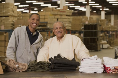 Manager standing with worker in warehouse