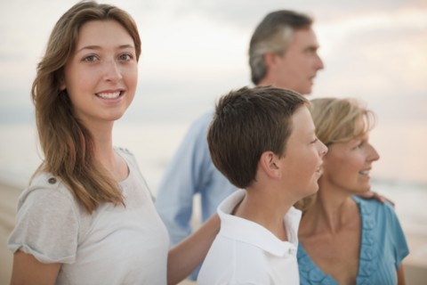 Caucasian family enjoying beach