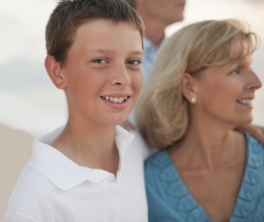 Caucasian family enjoying beach