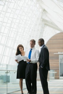 Business people working together in corridor