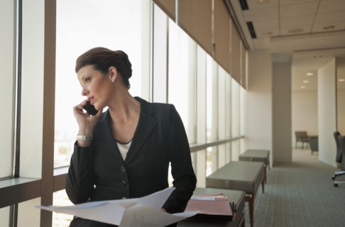 Caucasian businesswoman working in conference room
