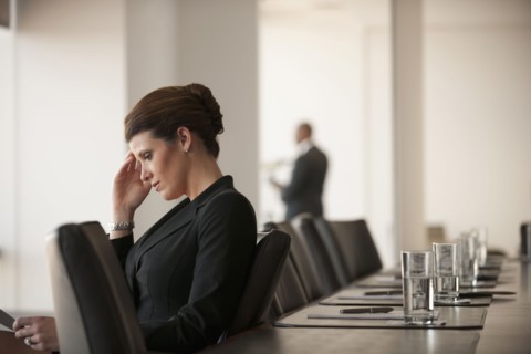 Caucasian business woman working in conference room