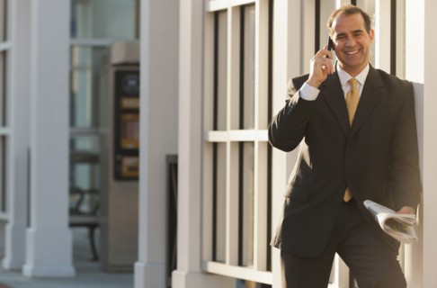 Caucasian man talking on cell phone outdoors
