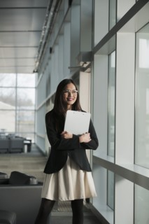 Asian businesswoman holding clipboard