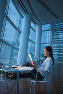 Asian businesswoman looking at paperwork