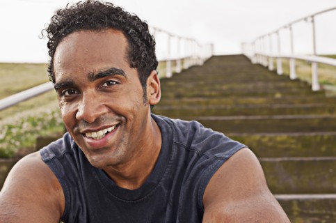 Smiling mixed race man