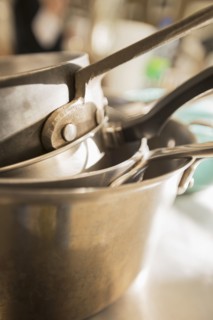 Close up of stacked pots and pans