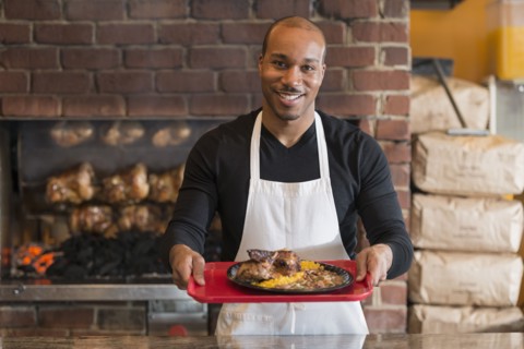 Black server working in restaurant