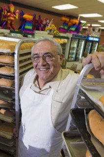 Hispanic baker working in commercial kitchen