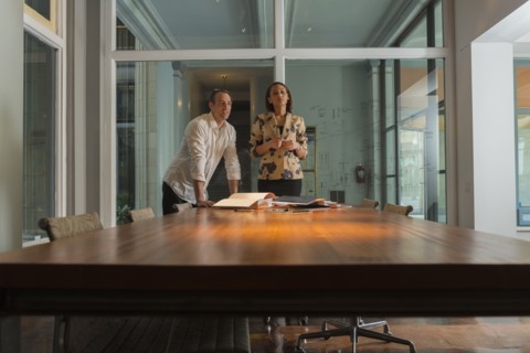 Business people standing in conference room