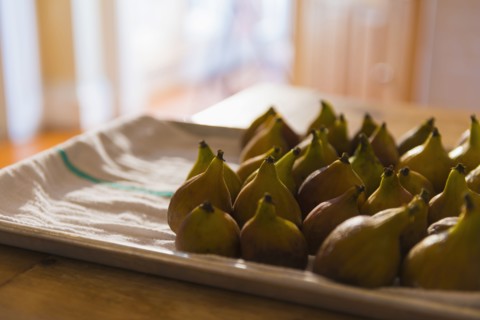 Plate of figs on towel